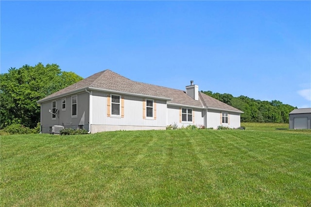 23404 Waverly Rd, Spring Hill, KS 66083 - rear view of property with a yard and a chimney