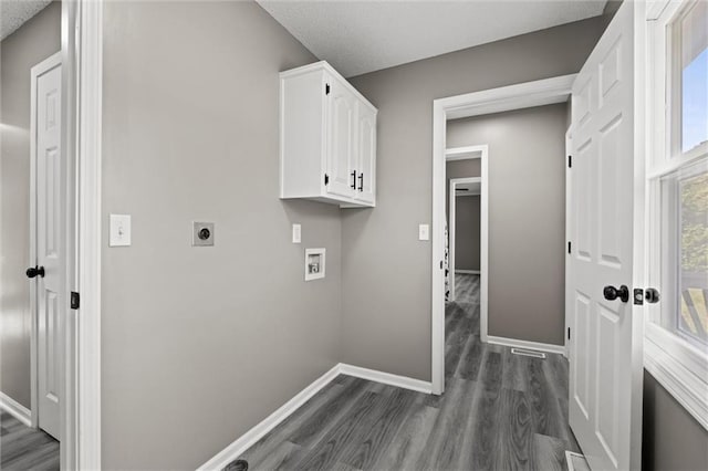 23404 Waverly Rd, Spring Hill, KS 66083 - washroom with cabinet space, electric dryer hookup, hookup for a washing machine, dark wood-style floors, and a textured ceiling