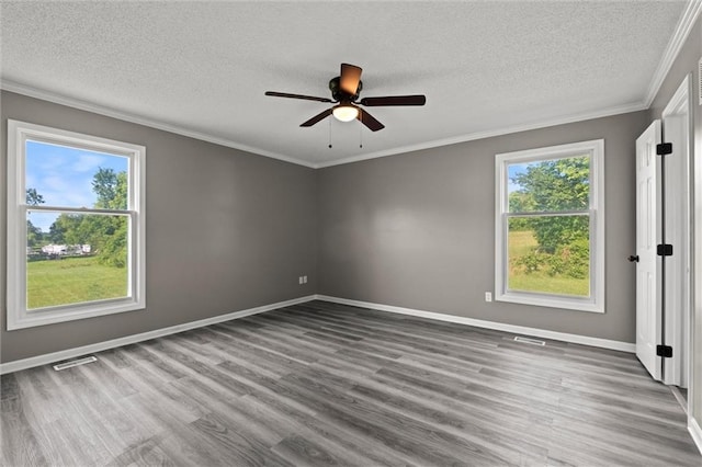 23404 Waverly Rd, Spring Hill, KS 66083 - empty room with plenty of natural light, wood finished floors, a textured ceiling, ceiling fan, and crown molding