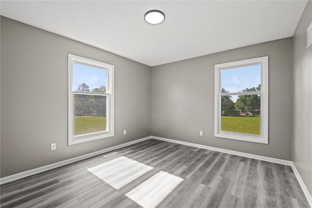 23404 Waverly Rd, Spring Hill, KS 66083 - unfurnished room with wood finished floors and baseboards