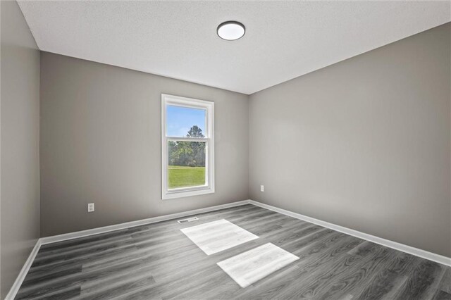 23404 Waverly Rd, Spring Hill, KS 66083 - spare room with wood finished floors and baseboards
