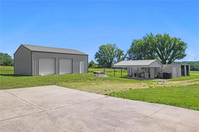 23404 Waverly Rd, Spring Hill, KS 66083 - view of grassy yard featuring a detached garage and an outbuilding