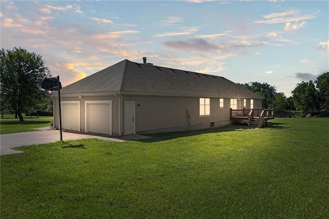 23404 Waverly Rd, Spring Hill, KS 66083 - property exterior at dusk featuring a lawn, a shingled roof, driveway, and a deck