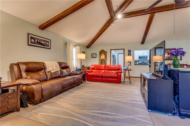 601 W 14th St, Pleasanton, KS 66075 - living room with light carpet, beam ceiling, and high vaulted ceiling