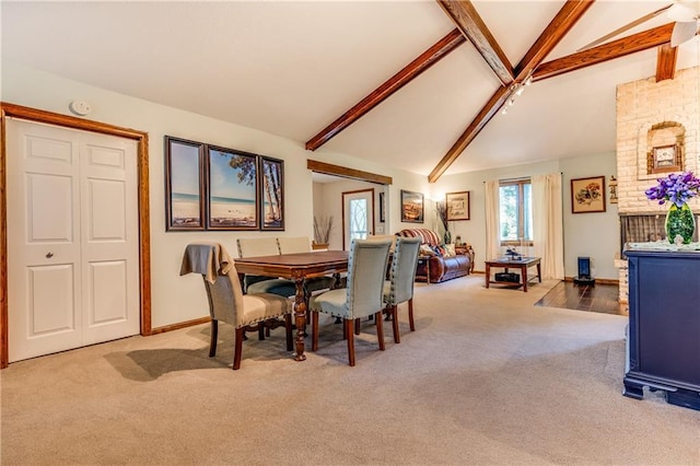 601 W 14th St, Pleasanton, KS 66075 - carpeted dining room featuring beam ceiling and high vaulted ceiling