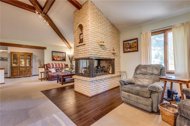601 W 14th St, Pleasanton, KS 66075 - living room with a fireplace, beam ceiling, high vaulted ceiling, and wood finished floors
