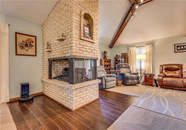 601 W 14th St, Pleasanton, KS 66075 - living area with a fireplace and dark wood-style floors