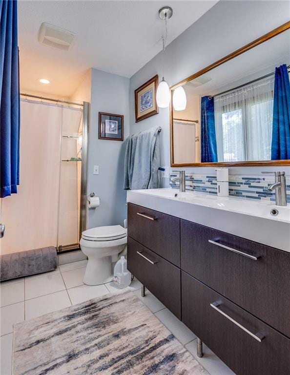 601 W 14th St, Pleasanton, KS 66075 - bathroom with vanity, tile patterned flooring, a shower with shower curtain, and tasteful backsplash