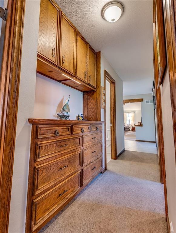 601 W 14th St, Pleasanton, KS 66075 - hall with light carpet and baseboards