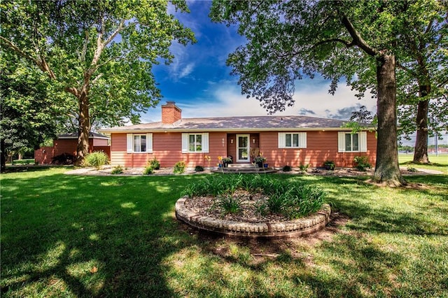 601 W 14th St, Pleasanton, KS 66075 - ranch-style home with a front yard and a chimney