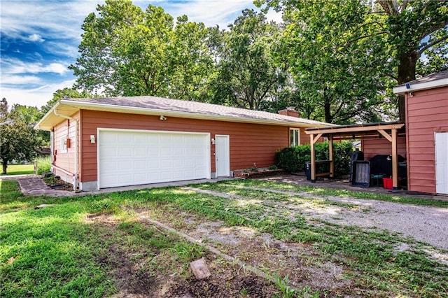 601 W 14th St, Pleasanton, KS 66075 - garage featuring driveway