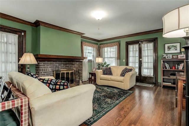 6033 Central St, Kansas City, MO 64113 - living area with dark wood-style flooring, crown molding, and a fireplace