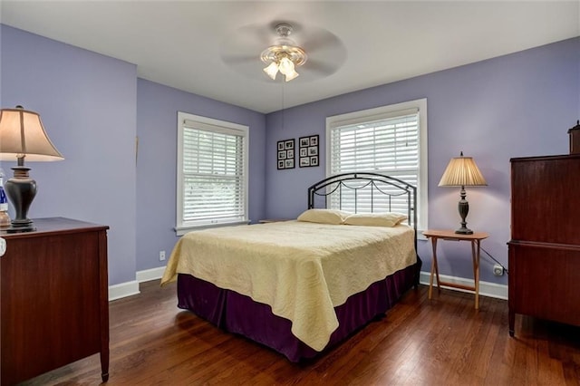 6033 Central St, Kansas City, MO 64113 - bedroom with wood finished floors and ceiling fan