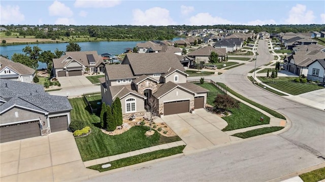1401 Spurlock Cv, Raymore, MO 64083 - aerial view of residential area with a large body of water