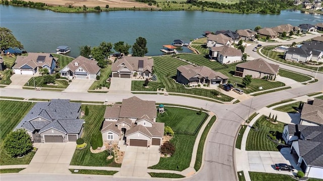 1401 Spurlock Cv, Raymore, MO 64083 - aerial view of property's location with nearby suburban area and a large body of water
