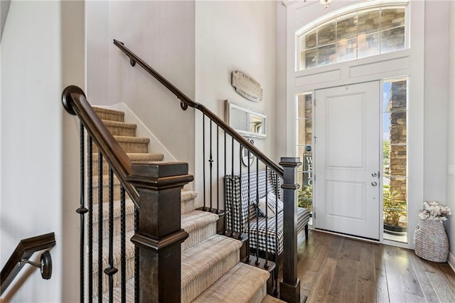 1401 Spurlock Cv, Raymore, MO 64083 - entryway with hardwood / wood-style floors, healthy amount of natural light, a high ceiling, and stairway