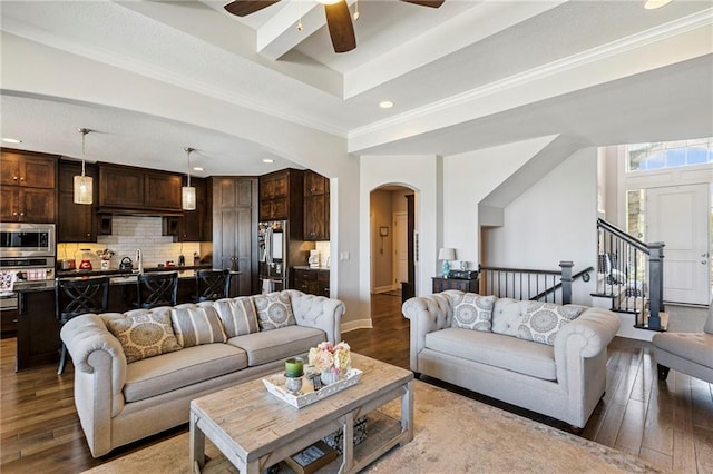1401 Spurlock Cv, Raymore, MO 64083 - living room featuring arched walkways, hardwood / wood-style floors, ceiling fan, recessed lighting, and a tray ceiling