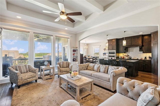 1401 Spurlock Cv, Raymore, MO 64083 - living room with healthy amount of natural light, ceiling fan, recessed lighting, wood finished floors, and arched walkways