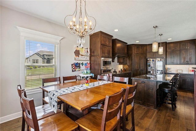 1401 Spurlock Cv, Raymore, MO 64083 - dining space with dark wood-type flooring, a chandelier, and recessed lighting