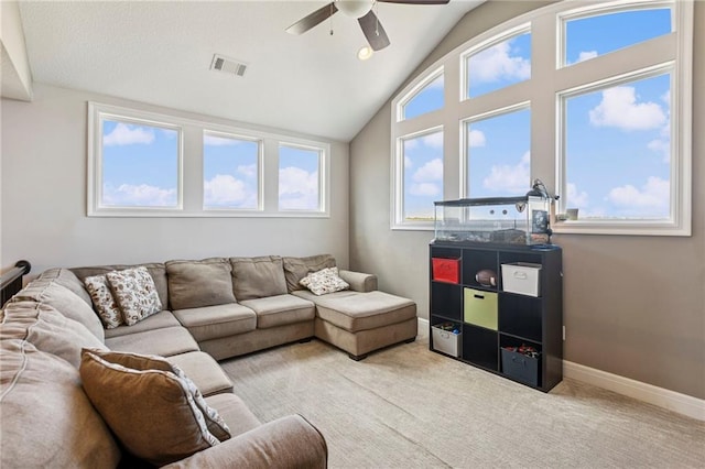 1401 Spurlock Cv, Raymore, MO 64083 - carpeted living area with ceiling fan and lofted ceiling