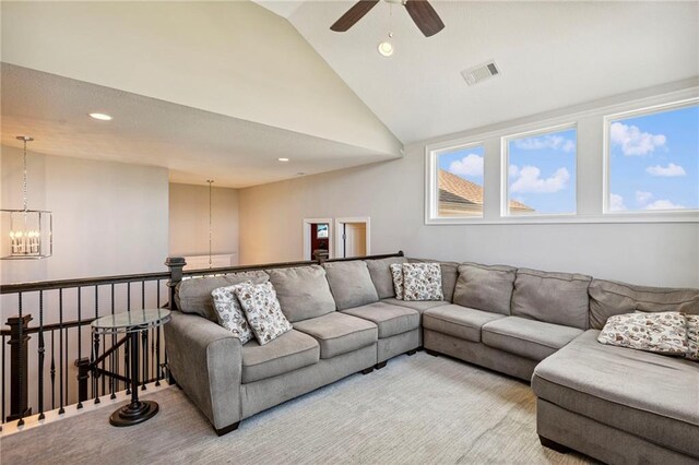 1401 Spurlock Cv, Raymore, MO 64083 - carpeted living area featuring a ceiling fan, vaulted ceiling, a chandelier, and recessed lighting