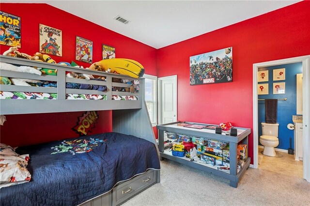 1401 Spurlock Cv, Raymore, MO 64083 - carpeted bedroom featuring ensuite bath