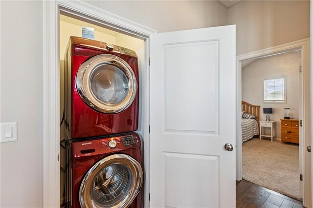 1401 Spurlock Cv, Raymore, MO 64083 - laundry room with estacked washer and dryer and wood finished floors