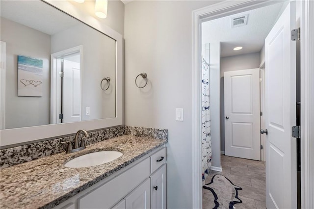 1401 Spurlock Cv, Raymore, MO 64083 - bathroom featuring vanity and baseboards