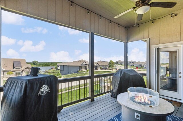 1401 Spurlock Cv, Raymore, MO 64083 - deck with grilling area, ceiling fan, and a residential view