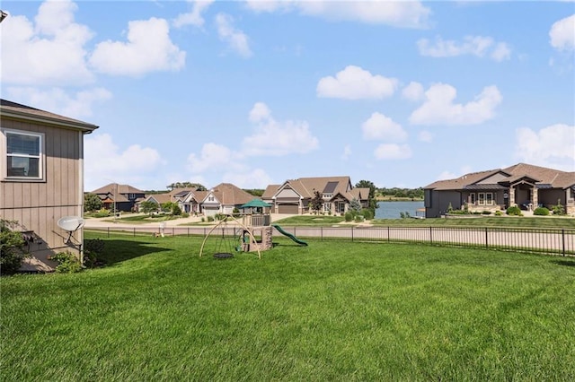 1401 Spurlock Cv, Raymore, MO 64083 - view of yard featuring a playground and a residential view