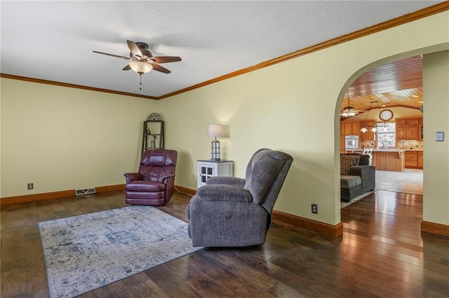 20212 S Carriage Ln, Peculiar, MO 64078 - living area with a ceiling fan, hardwood / wood-style flooring, arched walkways, crown molding, and lofted ceiling