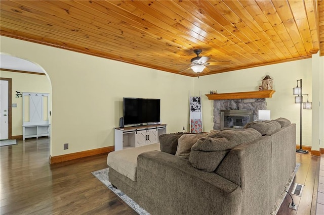 20212 S Carriage Ln, Peculiar, MO 64078 - living area featuring ornamental molding, wood ceiling, a stone fireplace, arched walkways, and wood finished floors