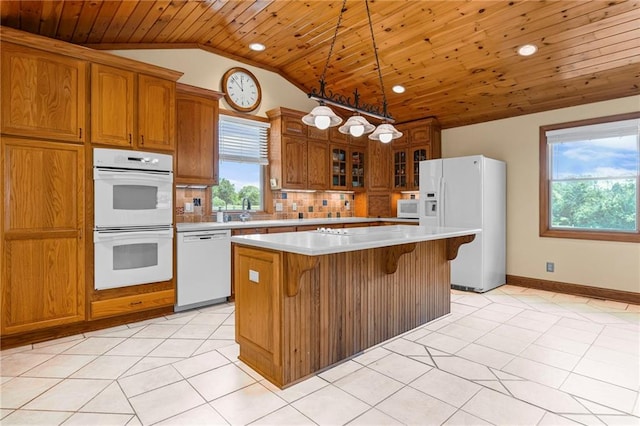 20212 S Carriage Ln, Peculiar, MO 64078 - kitchen with white appliances, wood ceiling, lofted ceiling, plenty of natural light, and brown cabinets