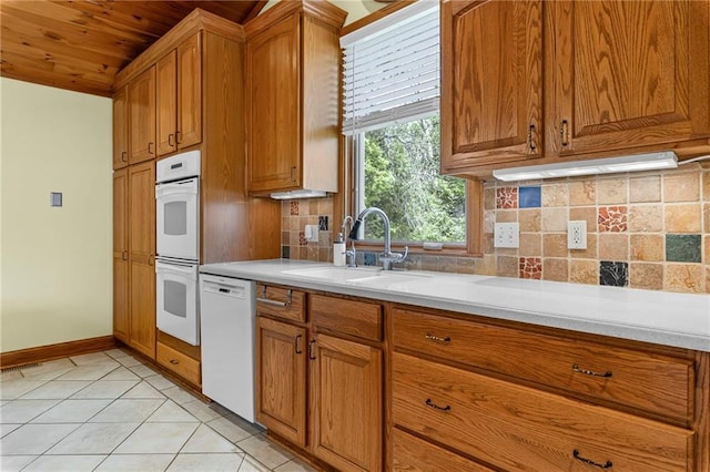 20212 S Carriage Ln, Peculiar, MO 64078 - kitchen featuring white appliances, light countertops, brown cabinetry, backsplash, and wooden ceiling