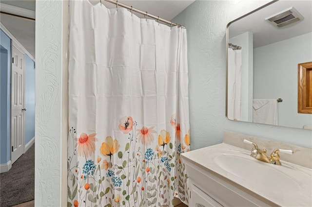 20212 S Carriage Ln, Peculiar, MO 64078 - bathroom with vanity, curtained shower, and a textured wall
