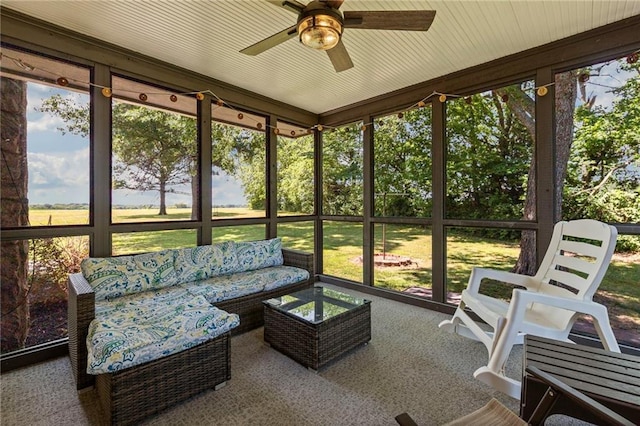20212 S Carriage Ln, Peculiar, MO 64078 - sunroom / solarium featuring ceiling fan, healthy amount of natural light, and an outdoor hangout area