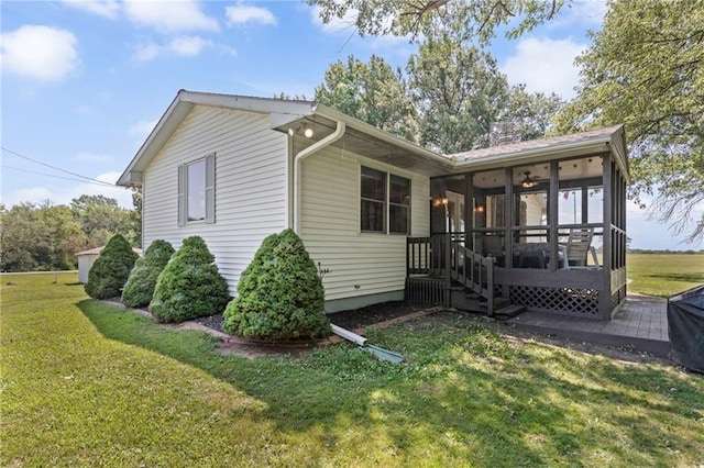 20212 S Carriage Ln, Peculiar, MO 64078 - view of home's exterior with a sunroom and a lawn