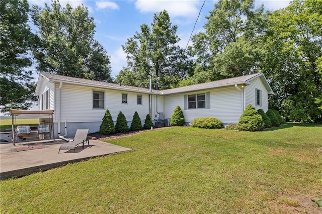 20212 S Carriage Ln, Peculiar, MO 64078 - view of front facade featuring a patio area and a front lawn