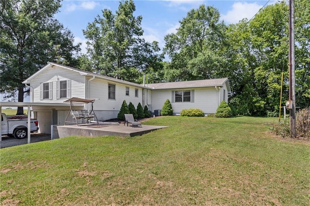 20212 S Carriage Ln, Peculiar, MO 64078 - rear view of property featuring a garage, a lawn, driveway, and a carport