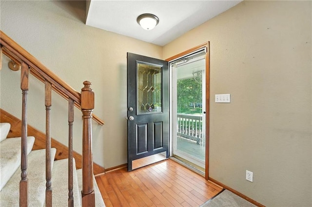 802 S Morgan Dr, Peculiar, MO 64078 - entrance foyer featuring light wood finished floors and stairway