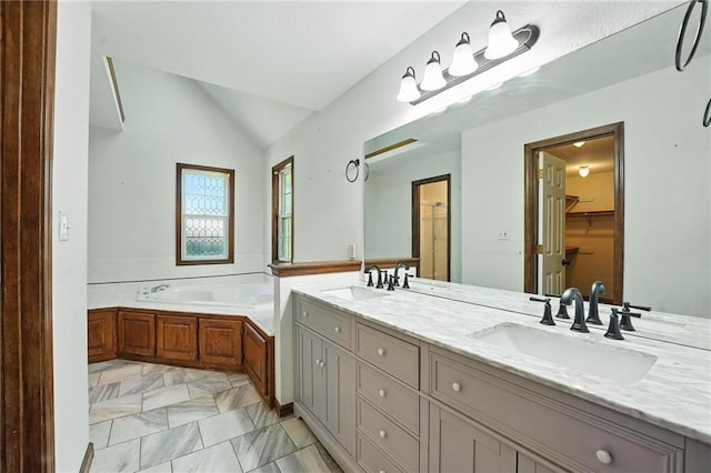 802 S Morgan Dr, Peculiar, MO 64078 - bathroom with vaulted ceiling, double vanity, a garden tub, marble finish flooring, and a spacious closet