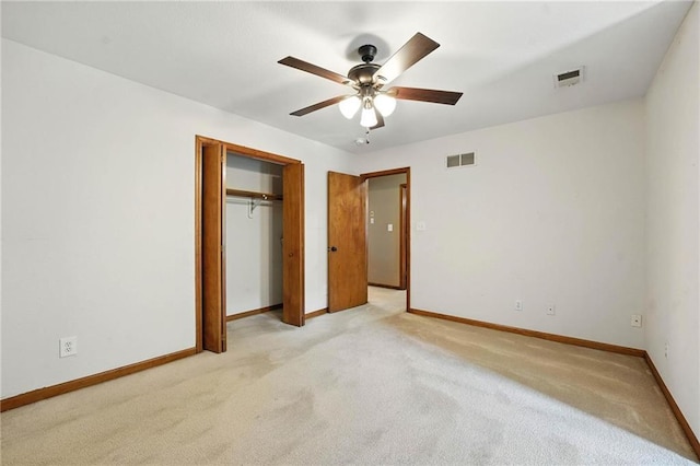 802 S Morgan Dr, Peculiar, MO 64078 - unfurnished bedroom with light carpet, a closet, and a ceiling fan