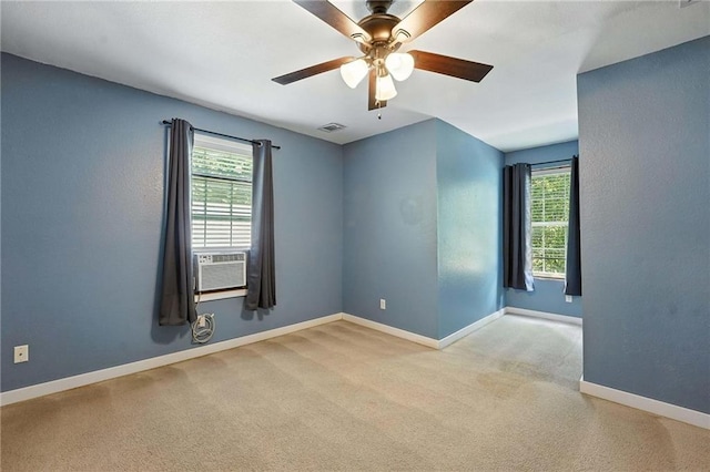 802 S Morgan Dr, Peculiar, MO 64078 - spare room featuring healthy amount of natural light, a ceiling fan, and carpet