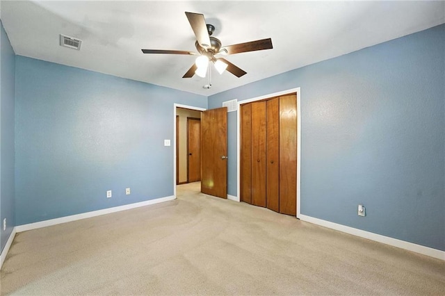 802 S Morgan Dr, Peculiar, MO 64078 - unfurnished bedroom featuring light colored carpet, a closet, and ceiling fan