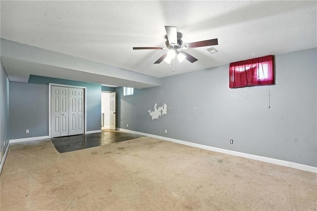802 S Morgan Dr, Peculiar, MO 64078 - unfurnished bedroom with carpet flooring, a textured ceiling, ceiling fan, and a closet