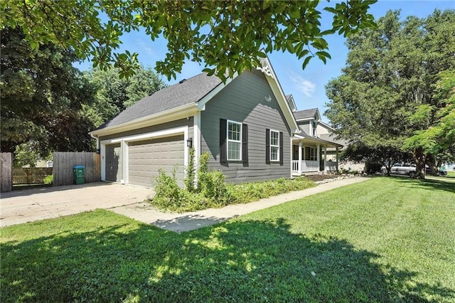 802 S Morgan Dr, Peculiar, MO 64078 - view of side of home with driveway, covered porch, and an attached garage