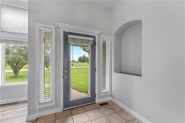 13785 E Nelson Rd, Nevada, MO 64772 - foyer entrance featuring plenty of natural light and light tile patterned floors