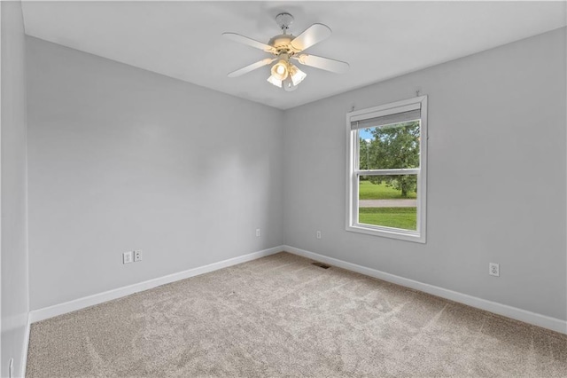 13785 E Nelson Rd, Nevada, MO 64772 - carpeted empty room with baseboards and ceiling fan