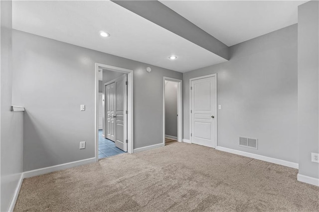 13785 E Nelson Rd, Nevada, MO 64772 - unfurnished bedroom with carpet floors, recessed lighting, and ensuite bath