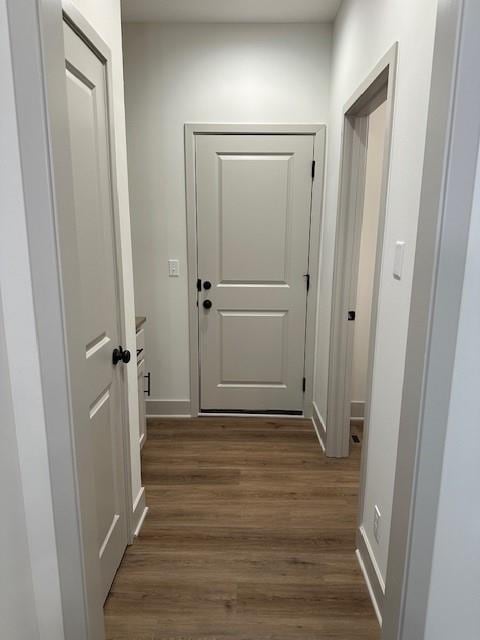 1309 N 4th St E, Louisburg, KS 66053 - entryway with dark wood-style flooring